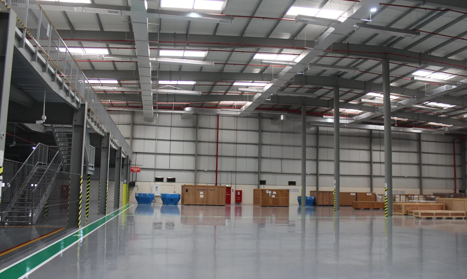 Wide open aerospace parts warehouse with mezzanine and high racking at Aerologix Global